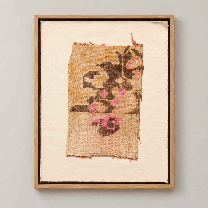 Framed vintage rug fragment wall art in apricot, brown, pink